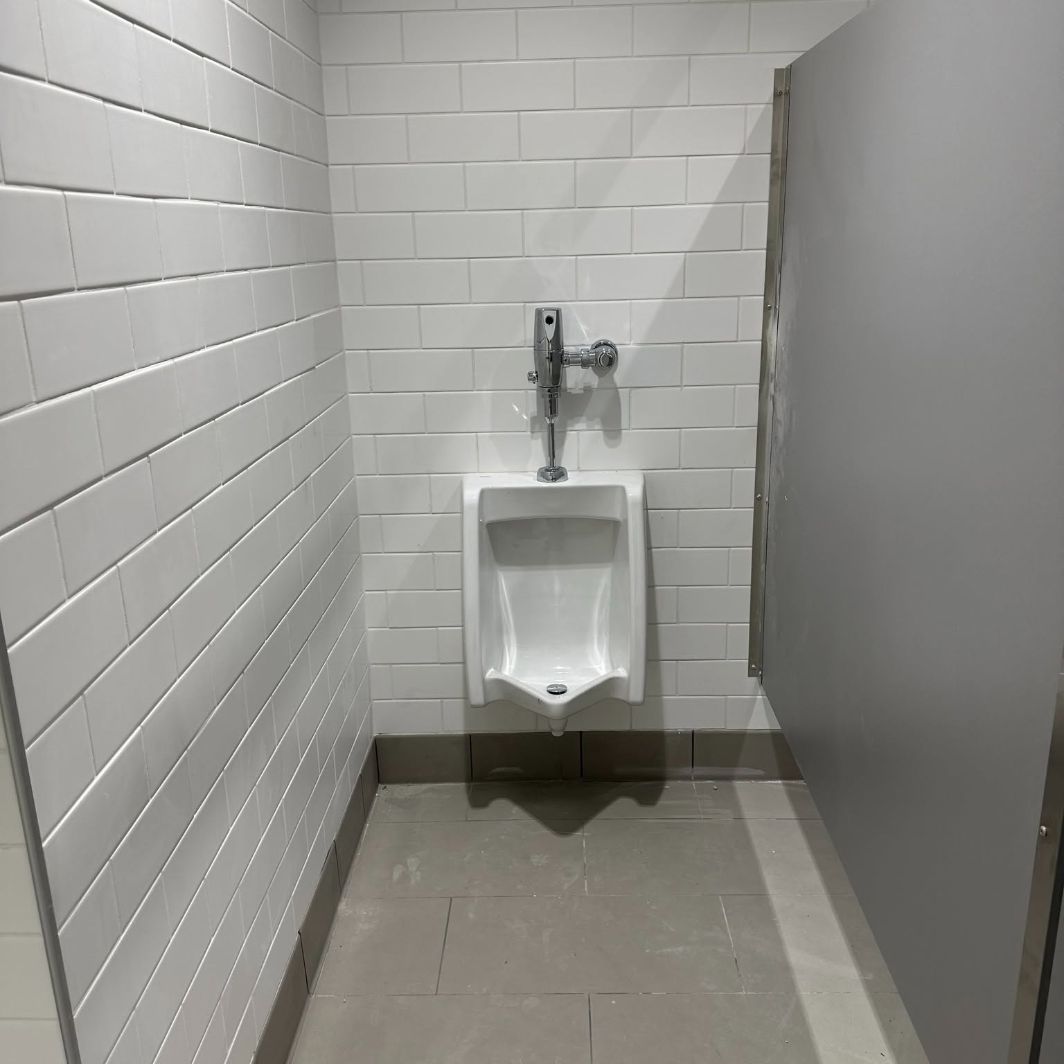 Commercial urinal installed by Holman's Quality Plumbing