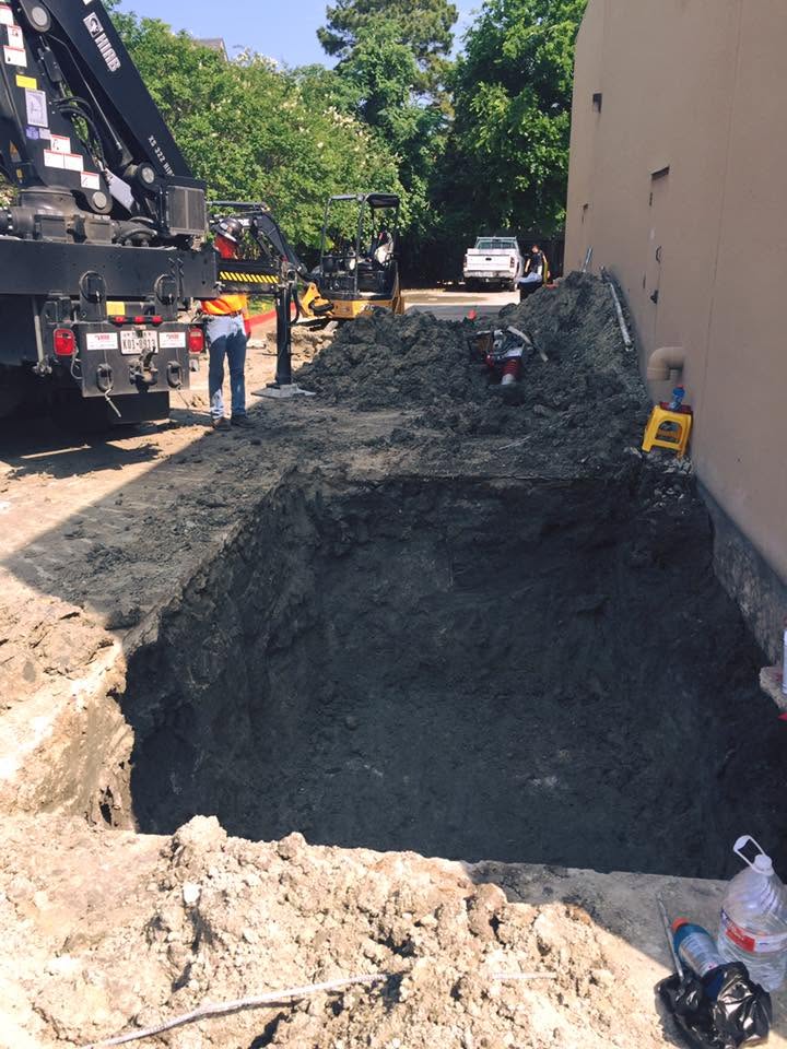 Crane truck supporting a large plumbing project