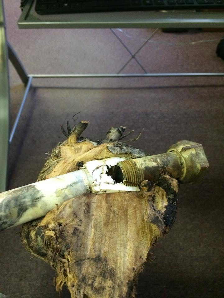 Damaged underground pipe exposed for repair