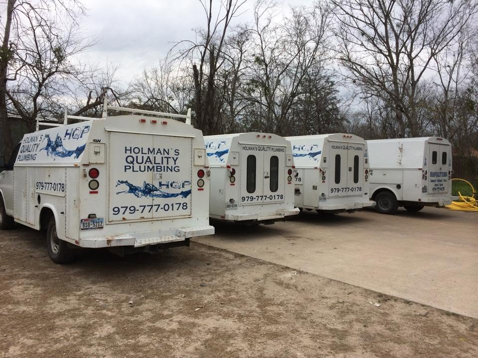 Holman's Quality Plumbing service vehicles serving Bryan and College Station