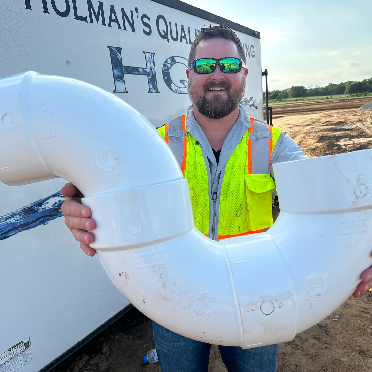 HQP technician installing a large PVC plumbing fitting